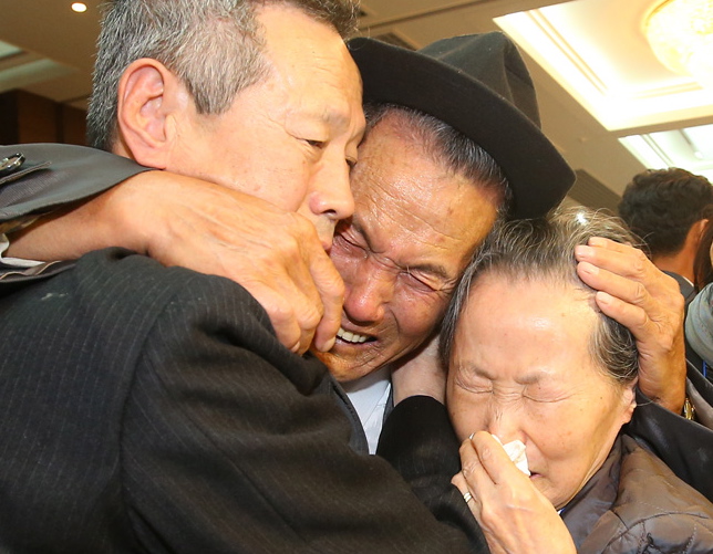 North Korean Sohn Kwon-geun (centre), 83, weeps with his South Korean family members during the reunion at Mount Kumgang resort in North Korea. PIC: Yonhap