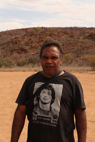 Tim MacNamara, artist and community worker from Hidden Valley, one of 16 town camps around the margins of Alice Springs. Seven town camps have no broadband internet. In Hidden Valley, up to 400 residents share one satellite WiFi hotspot. Photo: Else Kennedy