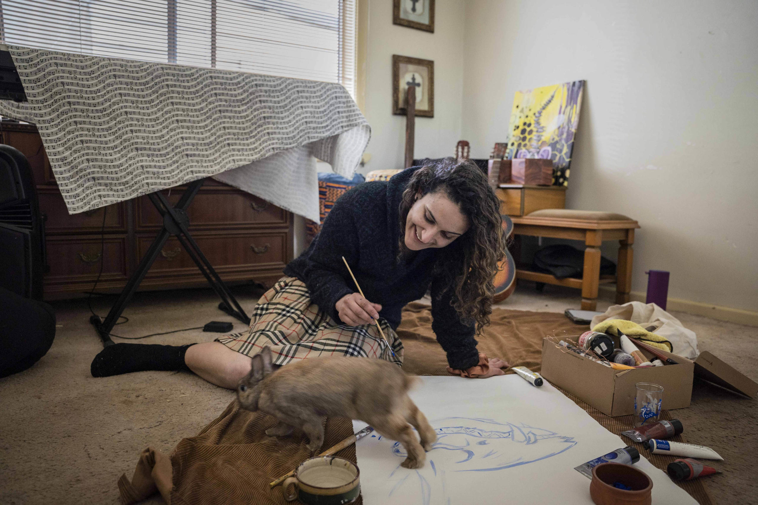 &ldquo;Making the most of a bizarre solitude includes laughing and creating, and the reminder that pets provide valuable company during Melbourne&rsquo;s long and frequent lockdowns&rdquo;, says Aleesha. When Patience was first adopted, she was very aggressive. But the time spent indoors during lockdown has helped Patience build a loving and trusting bond with Aleesha. Photo: Aleesha Paul