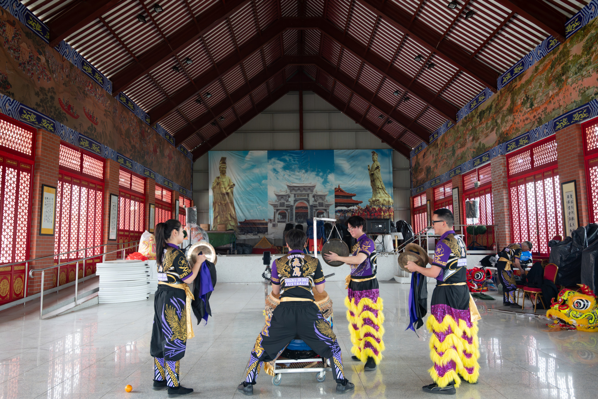 5 October 2024.&nbsp; The Feiying team is practicing their instruments: Frank Lam plays the drum(middle), Cecilia Young (left) and Alex Chau (second from the right) handle the cymbals, while Benjamin Lam (first on the right) plays the gong. They keep training until every drum beat is in perfect harmony.