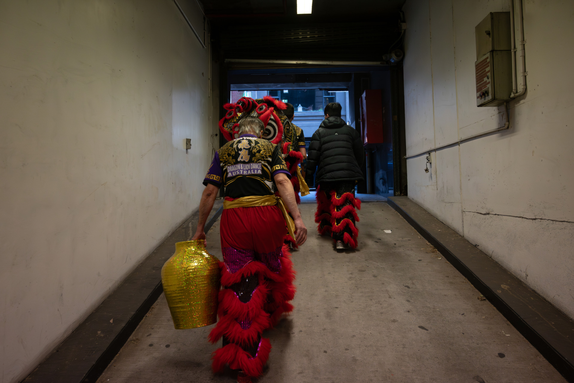 12 October 2024. Feiying perform at a wedding in Melbourne, Australia.&nbsp; The members of the Feiying move their equipment and lions from the underground carpark to the wedding venue, and will soon give a surprise performance to the guests.