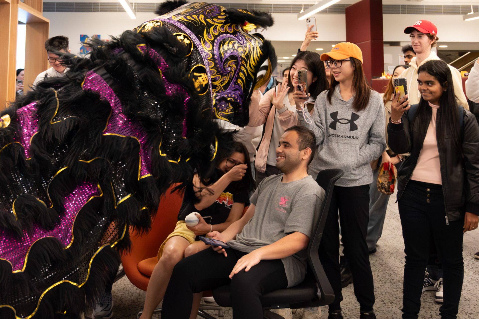 18 October 2024.&nbsp; Feiying members dress up as black and purple lions and present a wonderful performance for students in the university library. Benjamin flexibly manipulates the lion&rsquo;s head and interacts closely with students, creating a lively and cheerful atmosphere.