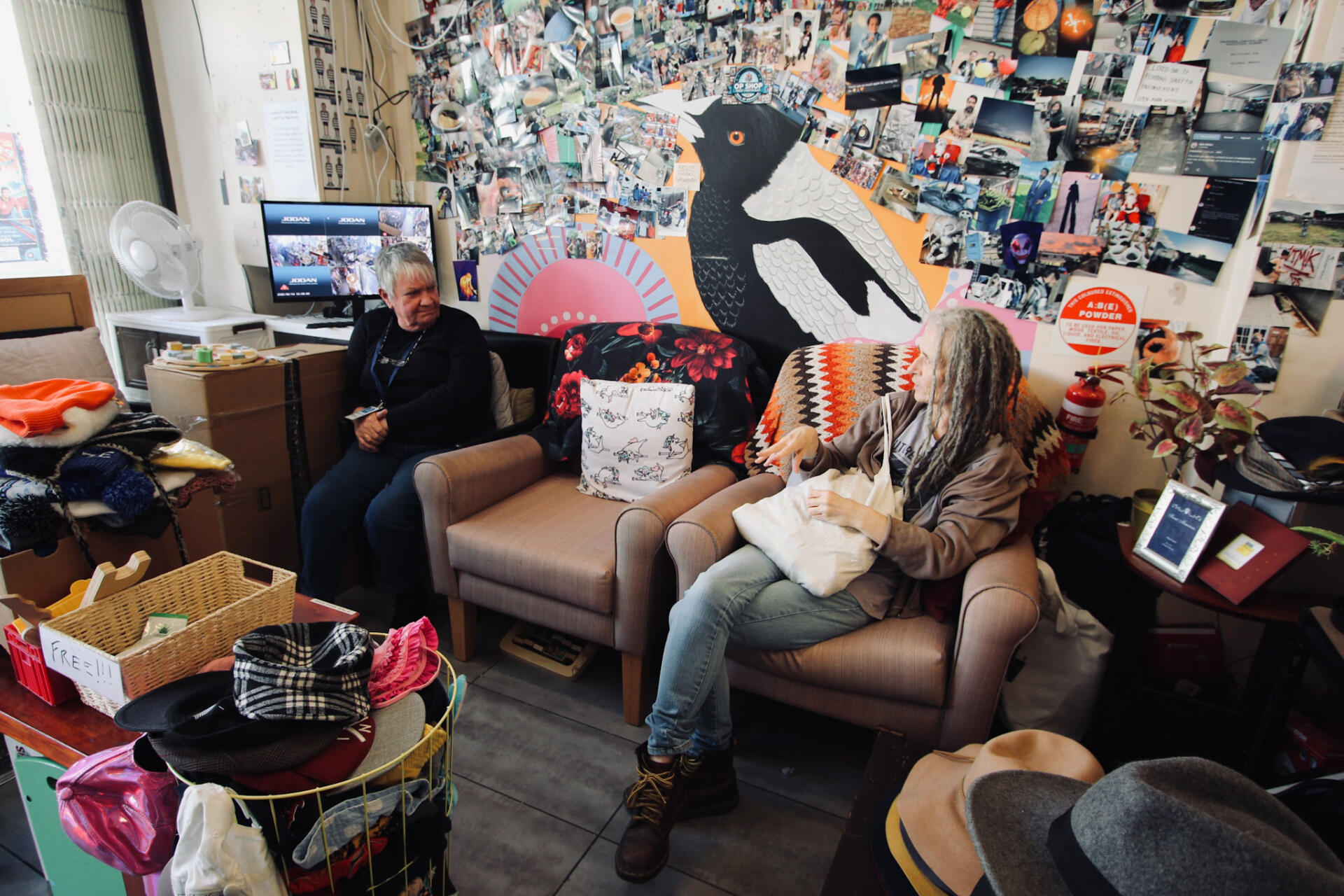 Volunteer Ella Brown, who lives with intermittent chronic fatigue syndrome, chats with staff member Tina Barrass at The Op Shop.