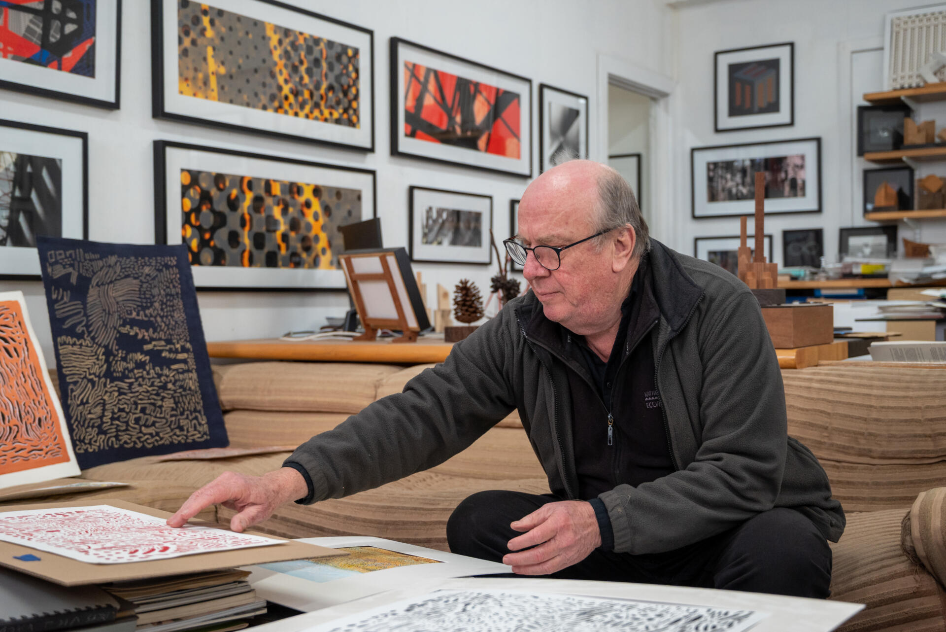 Treasurer Ian de Gruchy organizing his artwork. He transformed what used to be FML&rsquo;s meeting room into a combined studio, office and gallery.