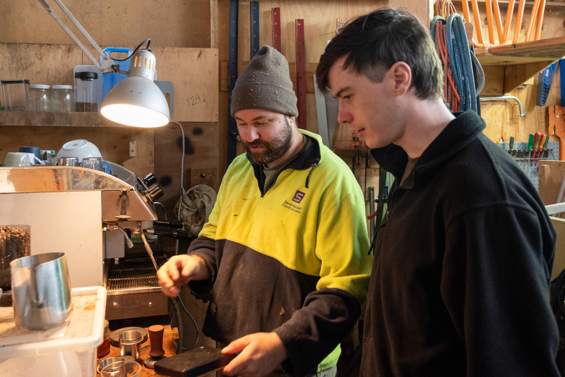 In the corner of his studio, Tom Scott brews coffee with fellow member Ben. A fixed-up machine and a tray of mismatched cups are always ready to welcome whoever stops in.