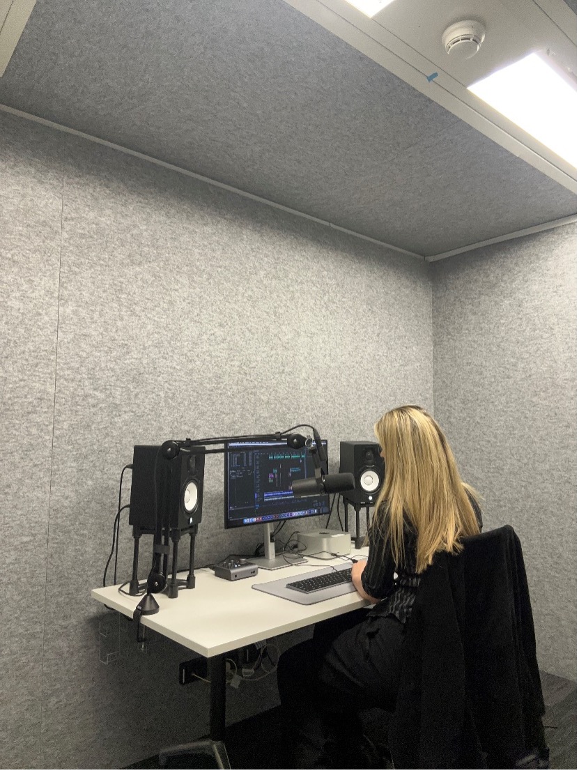 Dr Corey Martin producing her podcast. (Photo supplied)
