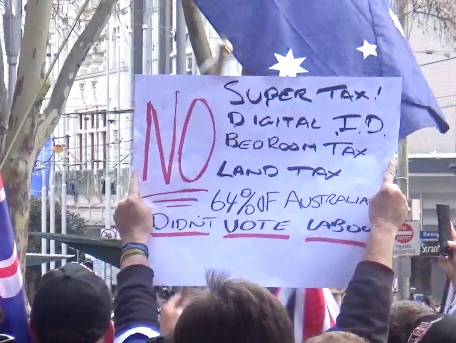 March for Australia demonstrator with protest sign. Photo by Alexandra Nevill.