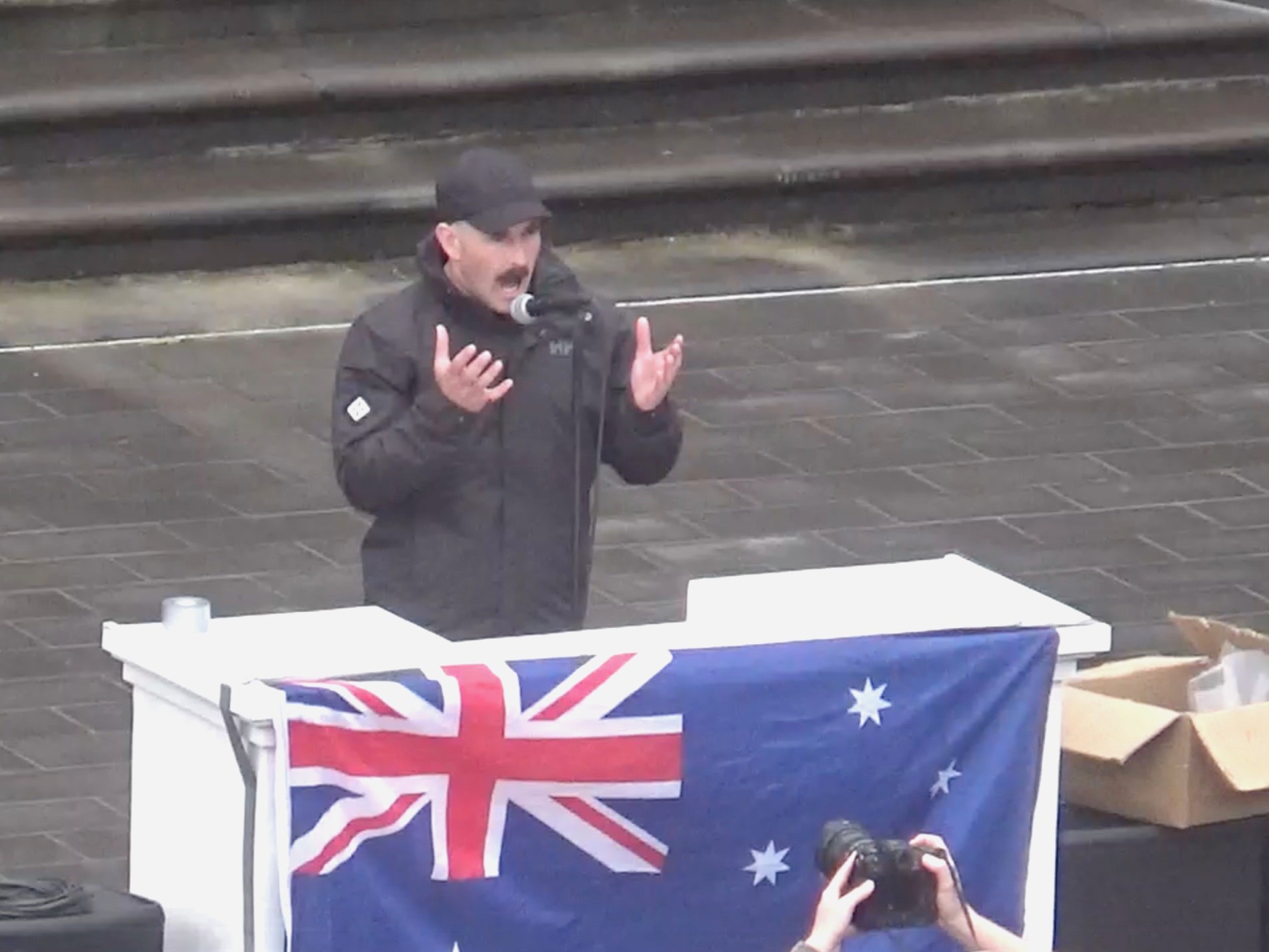 National Socialist Network leader Thomas Sewell addresses the rally from Parliament steps. Photo by Alexandra Nevill.