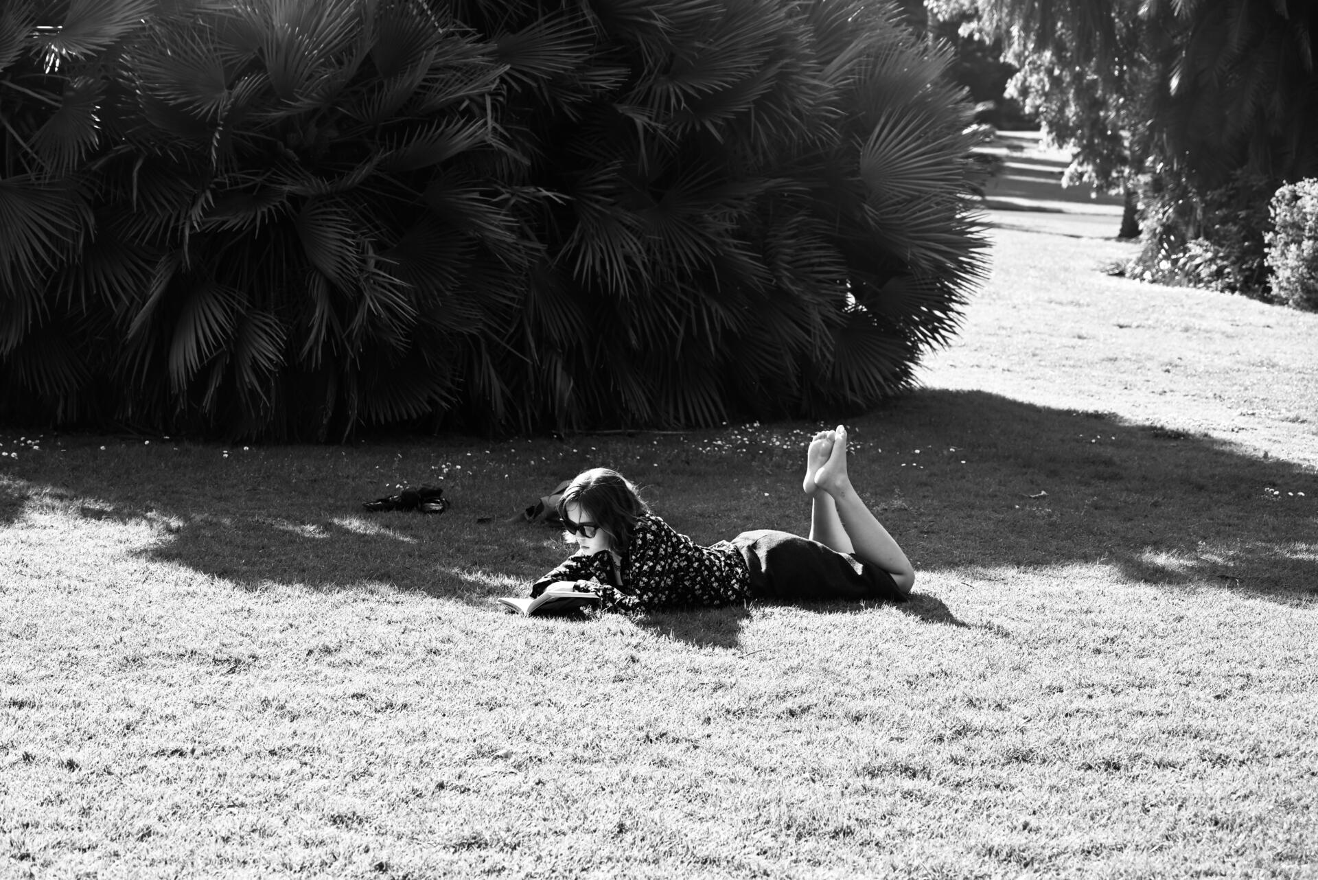 A woman relaxes on the lawn