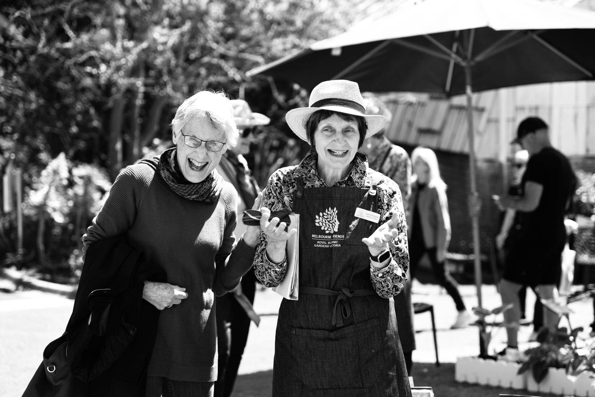 &ldquo;Growing Friends&rdquo; volunteer Susan La Marca (right) speaks with a visitor at the Spring Plant Sale