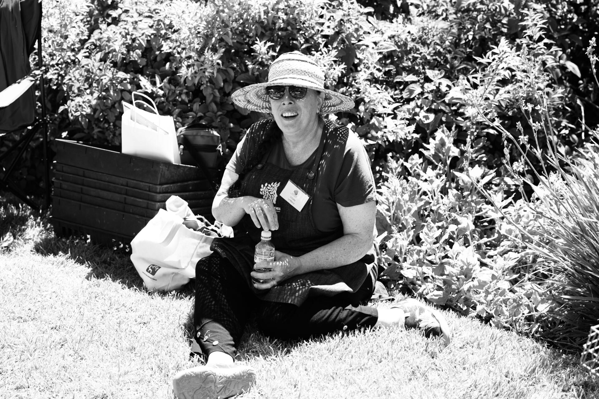 A &ldquo;Growing Friends&rdquo; volunteer takes a rest during the Spring Plant Sale