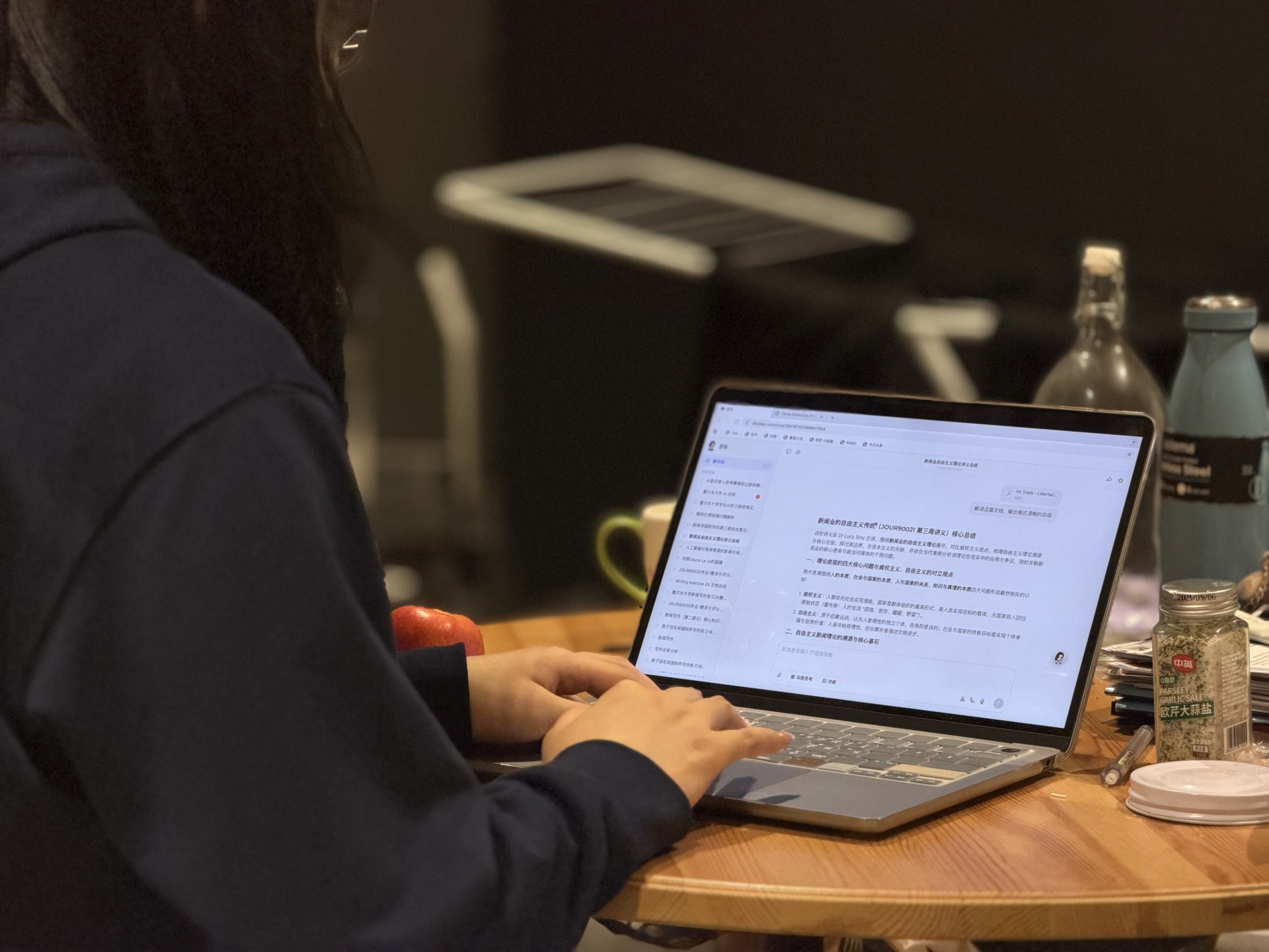 A student processes lecture content through a Chinese-language AI translation tool. Image: Xinran Yu