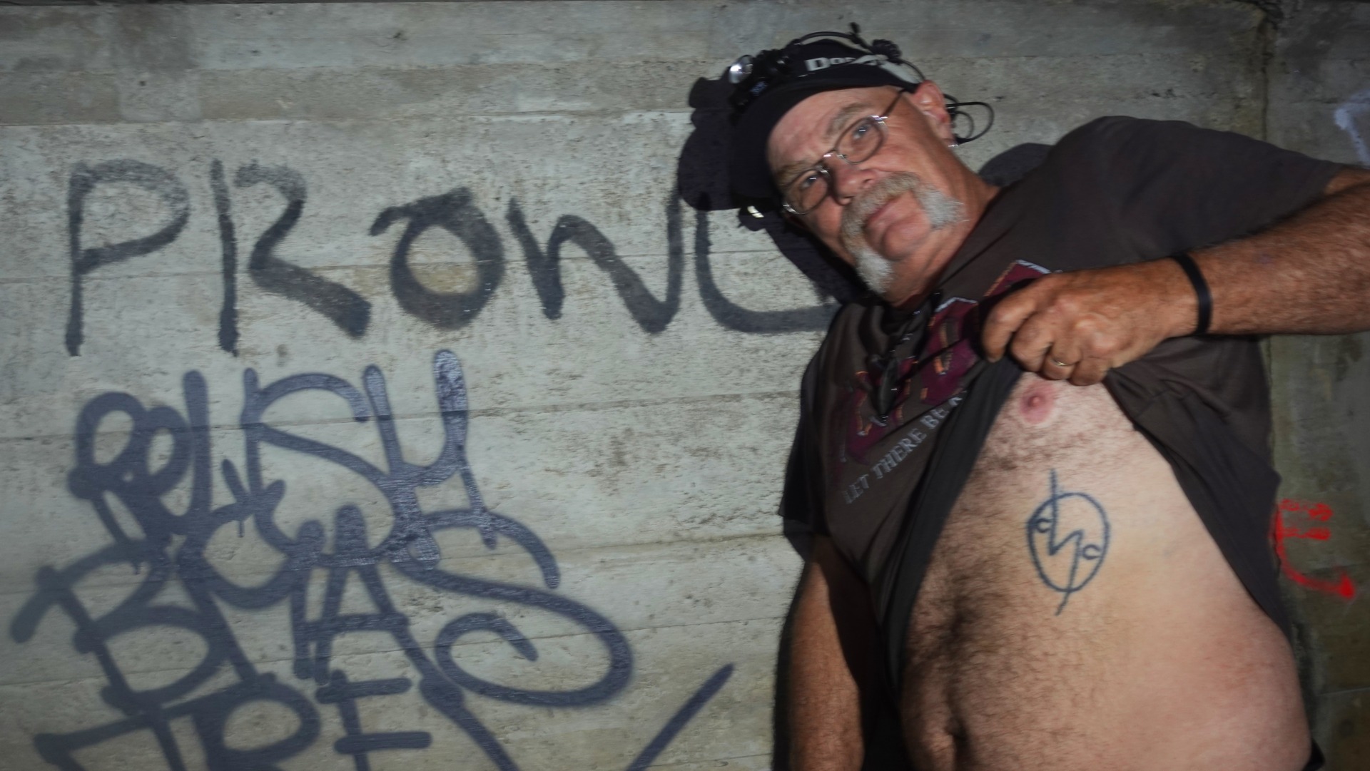 Dave &ldquo;Prowler&rdquo; George shows off his artwork. April 2026. Photo: Harry Robertson.