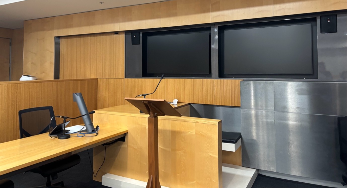 An empty witness chair in a courtroom. Image: Luisa Bonazzoli.