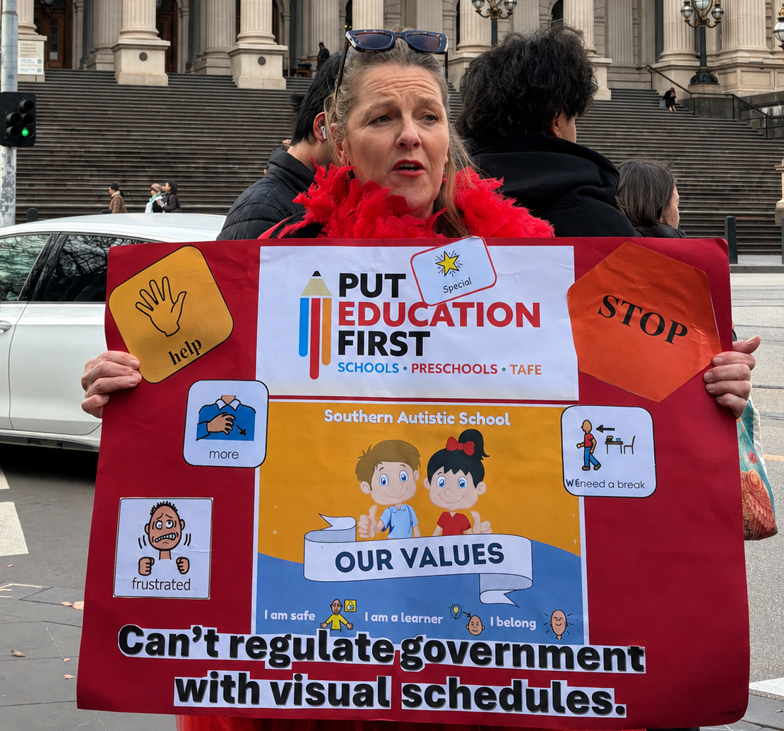 Luisa Thiedeman, an education support worker from Southern Autistic School, marches with a sign detailing her school&rsquo;s support values. With only $25 per term for supplies across six students, educators like her say the funding crisis makes the job impossible without personal sacrifice. Photo by Preeshita Shah.