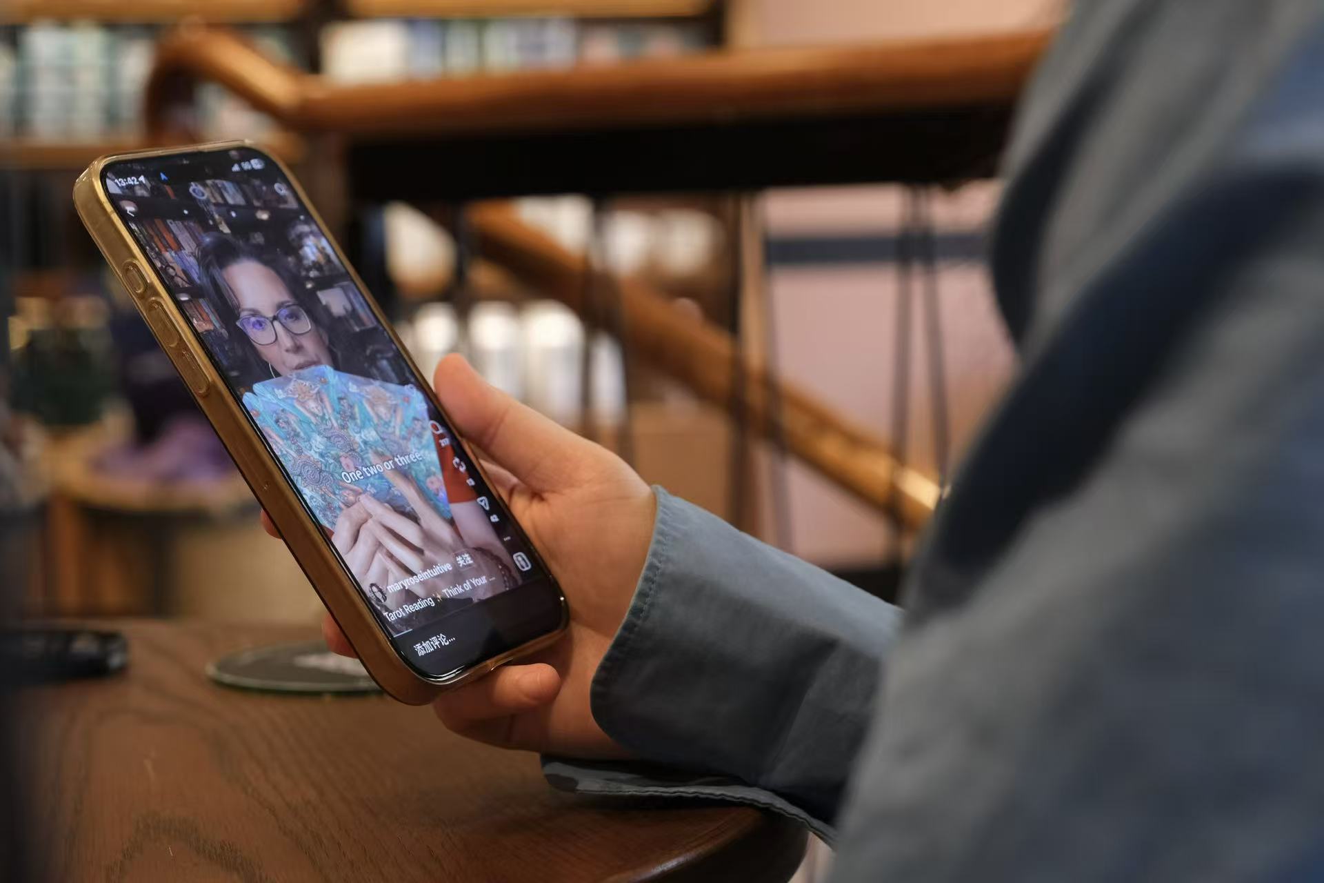 A tarot video appears on Tim Au&rsquo;s social media feed. Photo by Wanying Ou.